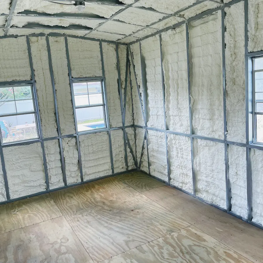 Closed-cell spray foam insulation applied to wall cavities in a residential project in Raynham